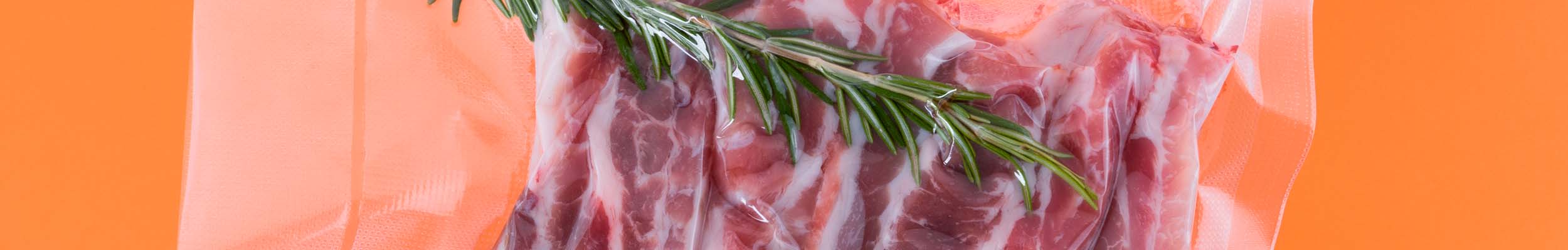 Sous Vide Vacuum Sealed Bag with Meat and Rosemary