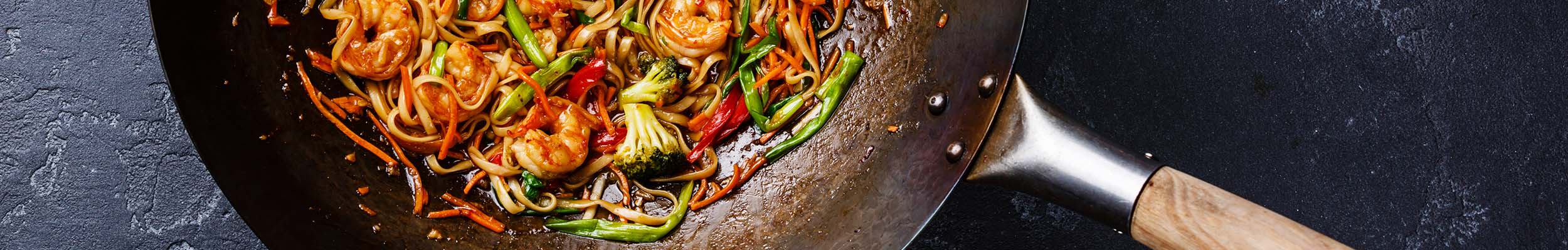 Carbon Steel wok with shrimp and noodle stir fry