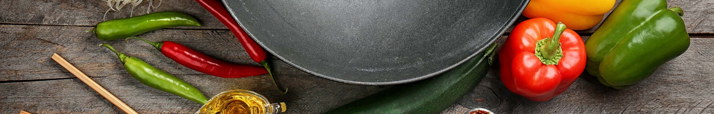 Double Handle Cast Iron Wok with Veggies for Chef's Kitchen