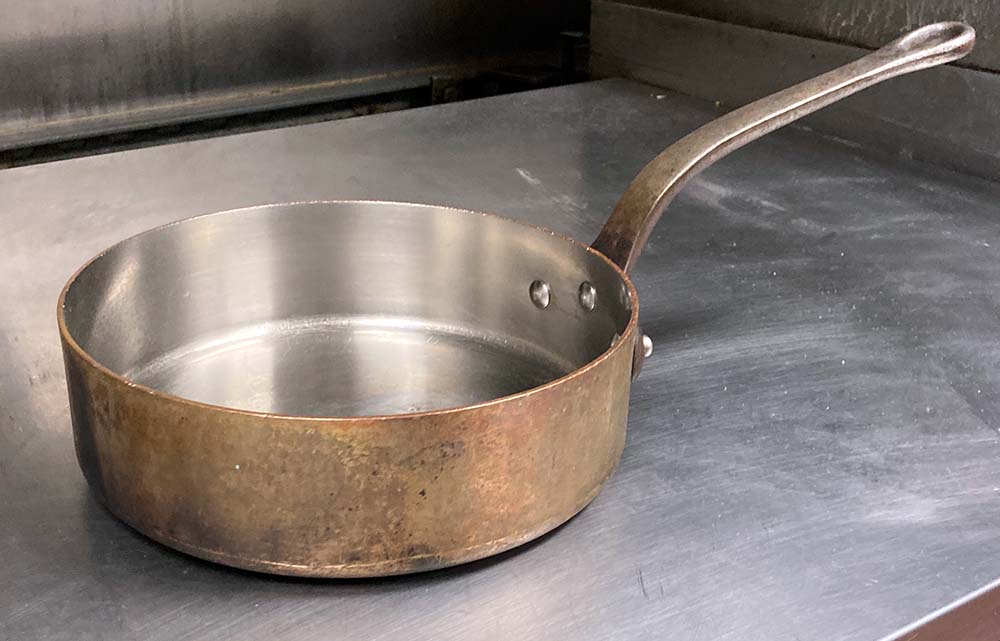 copper pan in commercial kitchen
