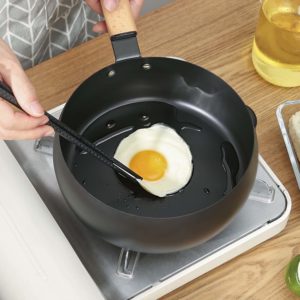 egg cooking on teflon pan