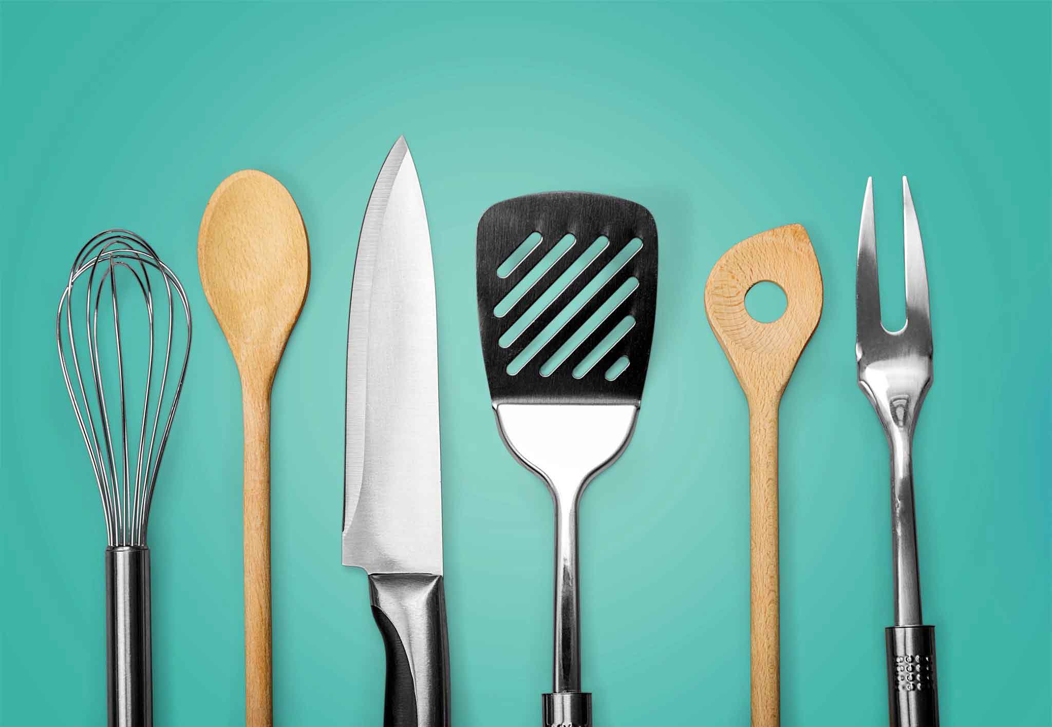 Several metal and wooden kitchen utensils which is the best material