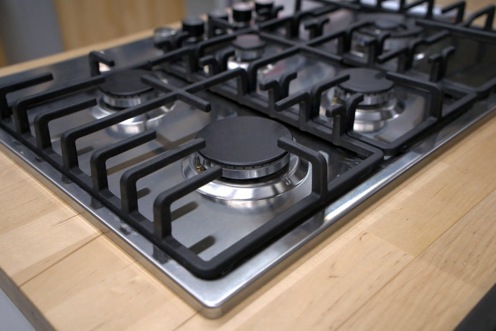 Gas stove with five burners each a different size
