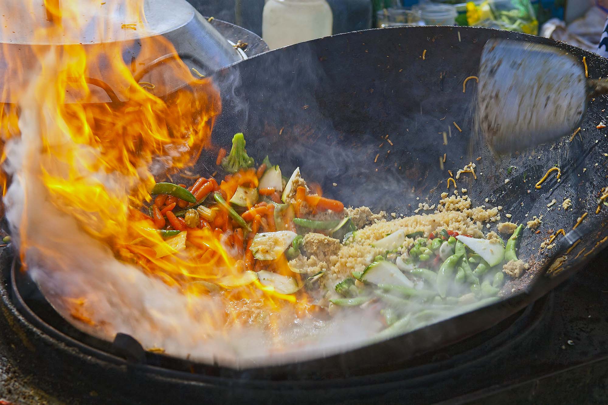 Outdoor wok burners with high BTU can flame up good like this one.